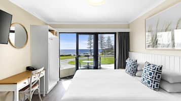 Deluxe Room, 1 King Bed, Ocean View | In-room safe, desk, laptop workspace, blackout drapes