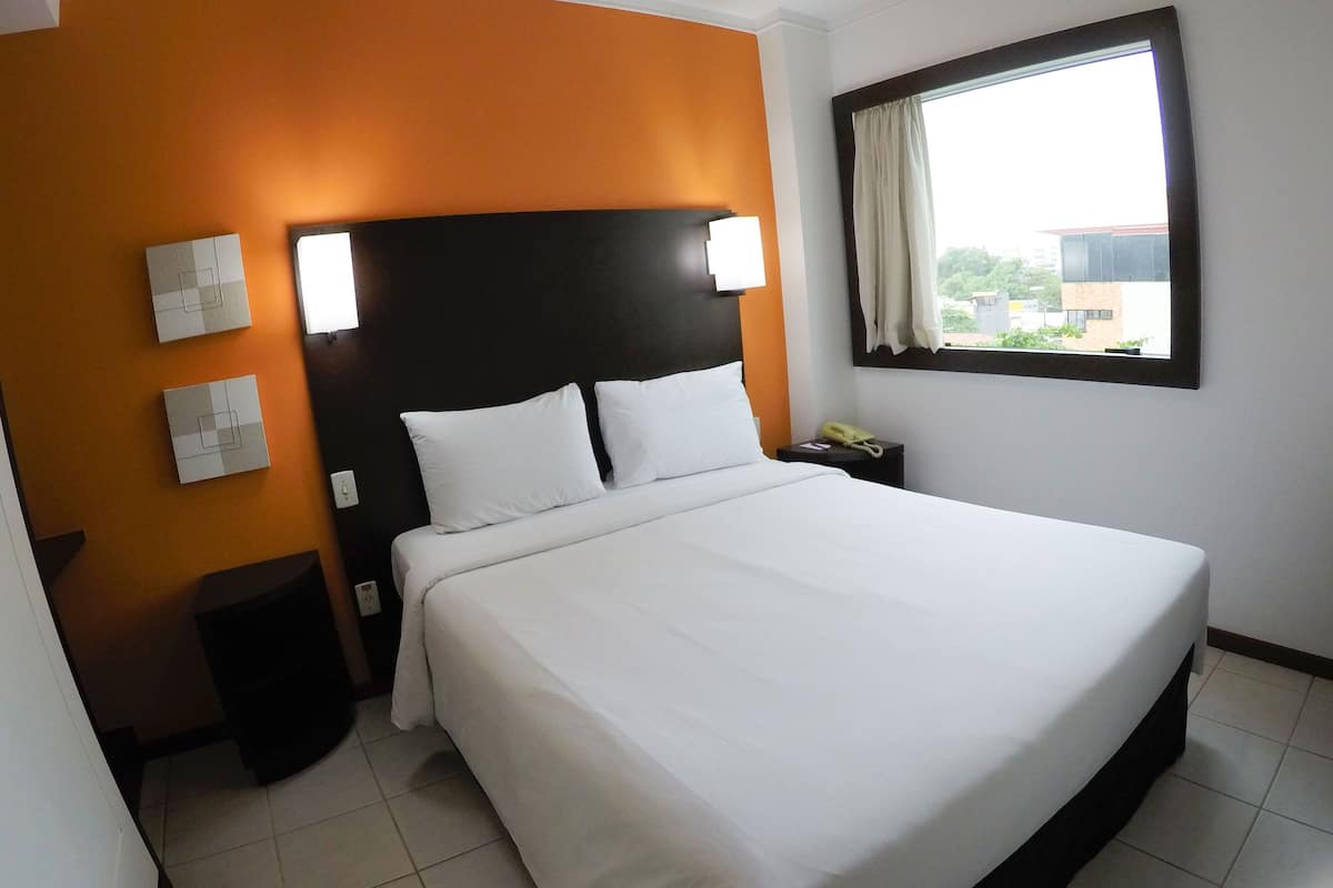 Double Room | Minibar, in-room safe, desk, blackout drapes