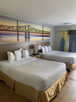 A hotel room with two beds, a painting of a bridge, a lamp, and a curtain.