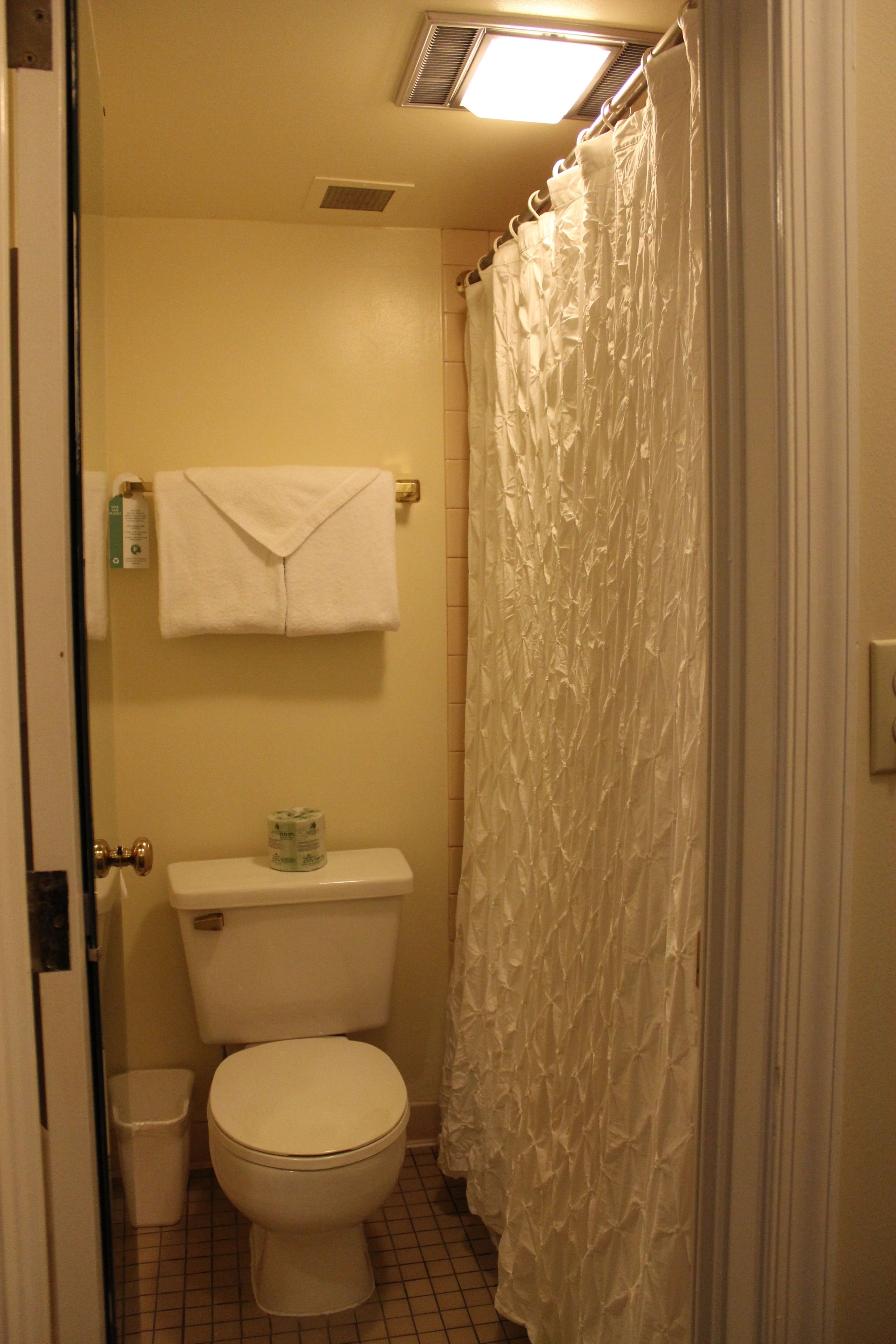 deluxe king | bathroom | combined shower/bathtub, free toiletries, hair dryer, bathrobes