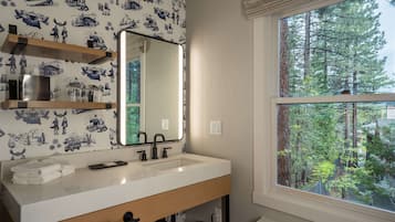 Shower, designer toiletries, hair dryer, towels