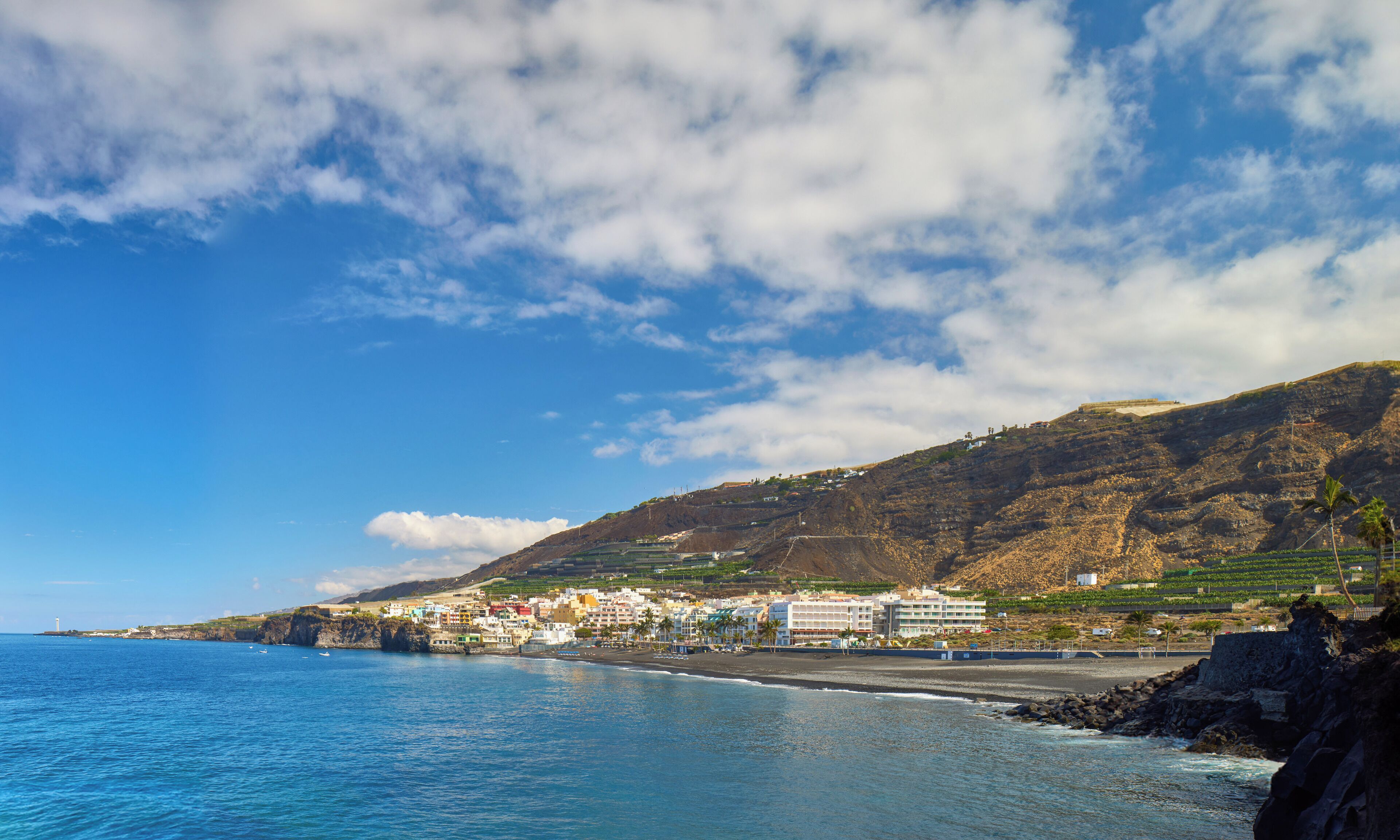 On the beach, black sand