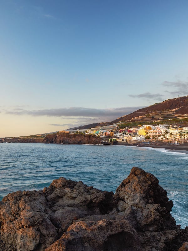 On the beach, black sand