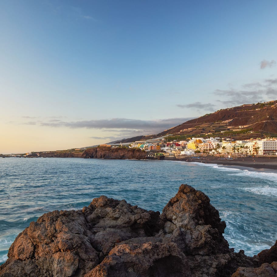 On the beach, black sand