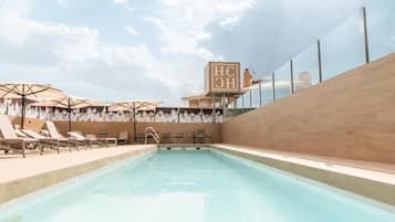 Outdoor pool, open 11:00 AM to 8:00 PM, pool loungers