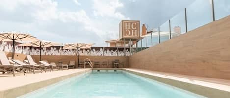 Outdoor pool, open 11:00 AM to 8:00 PM, sun loungers