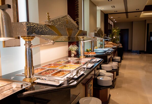 A buffet setup with multiple food stations and a variety of dishes. - Hotel Andalucia Center (Granada)