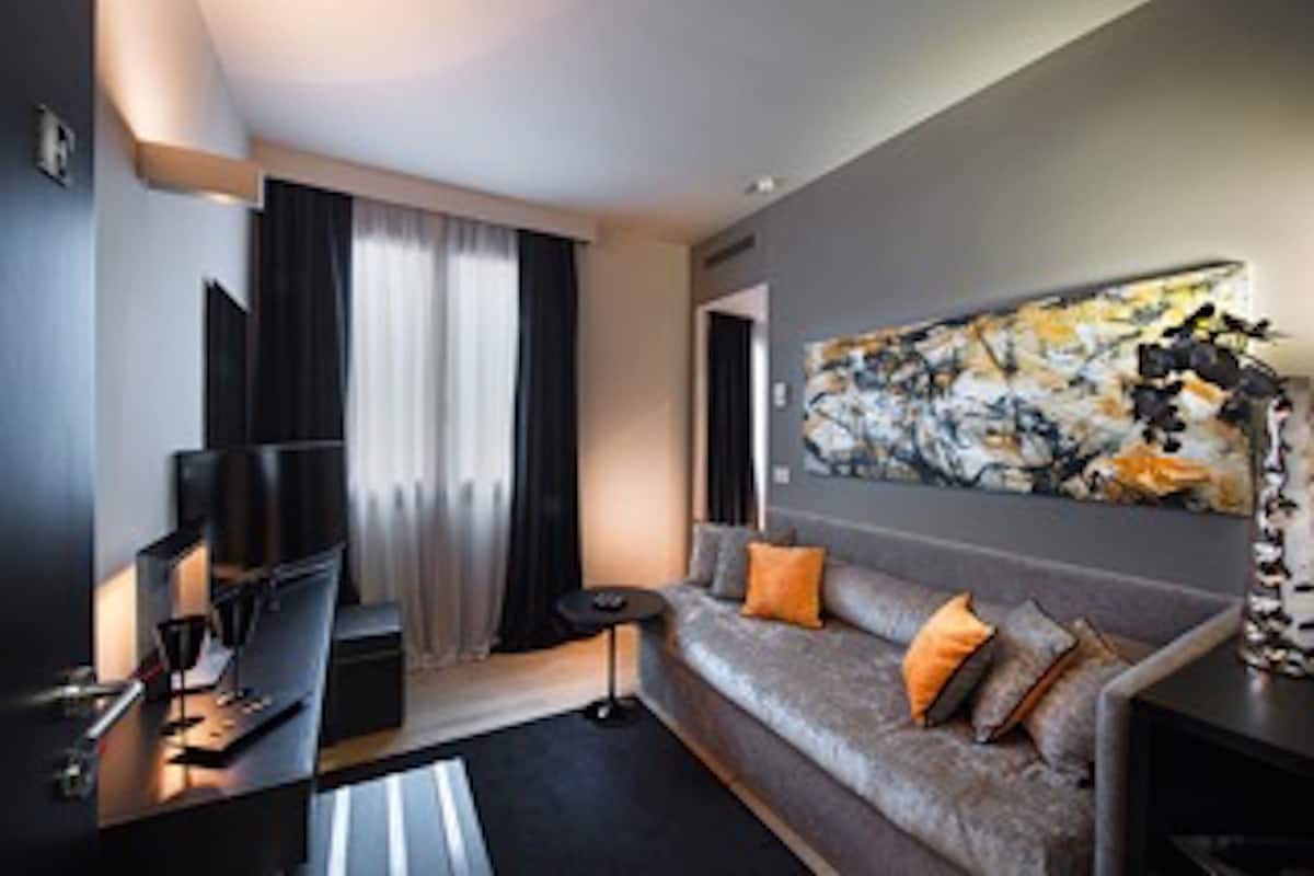 Suite, 1 Queen Bed | Living area | LCD TV