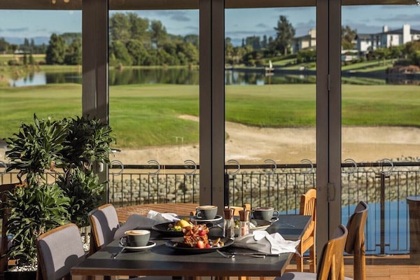 Breakfast, lunch, dinner served; golf course views