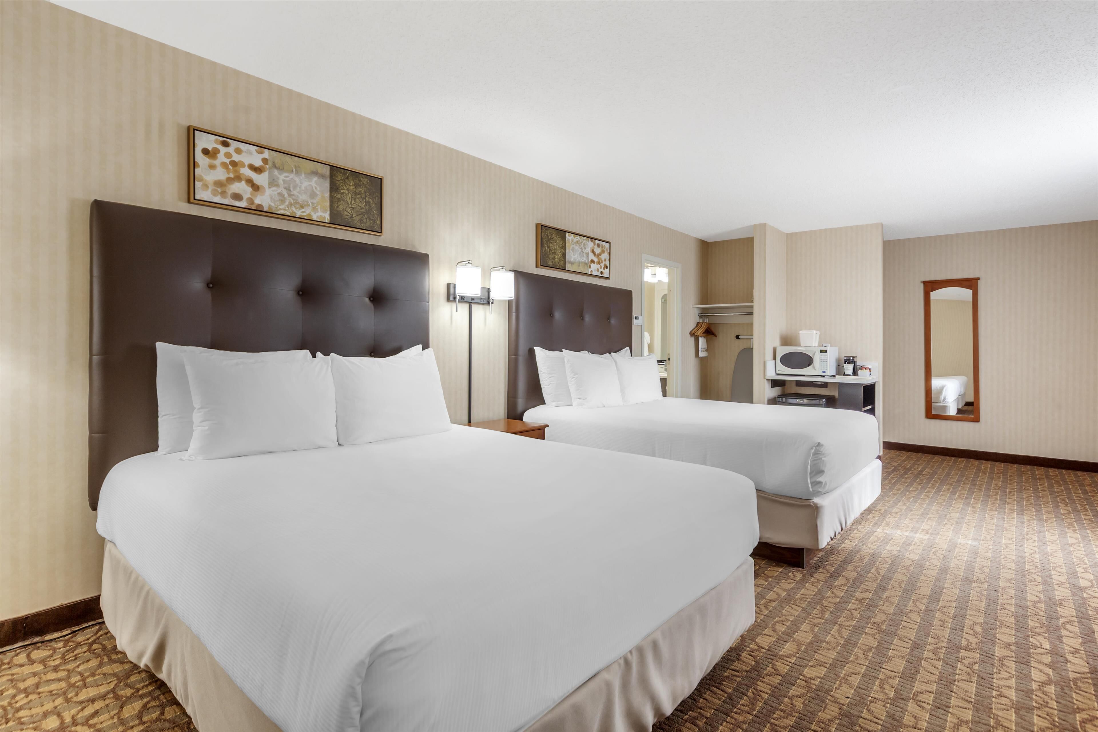 standard room, 2 queen beds, non smoking, refrigerator & microwave (larger room) | 1 bedroom, laptop workspace, iron/ironing board, free wifi