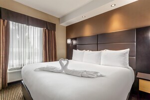 Suite, 1 King Bed, Non Smoking, Fireplace (Walk-in Shower) | Laptop workspace, iron/ironing board, free WiFi, bed sheets