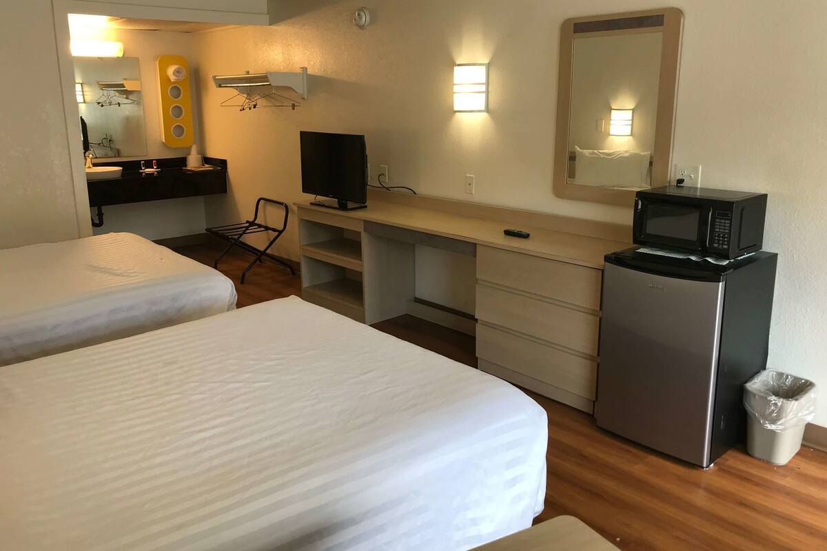 Desk, iron/ironing board, cribs (free), WiFi (free)