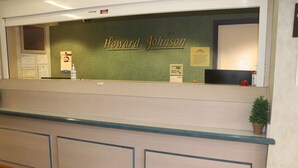 A reception desk with a sign reading "Howard Johnson." - Howard Johnson by Wyndham Tifton GA I-75 (Tifton)