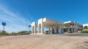 A 6-star hotel with a covered outdoor area and multiple balconies.
