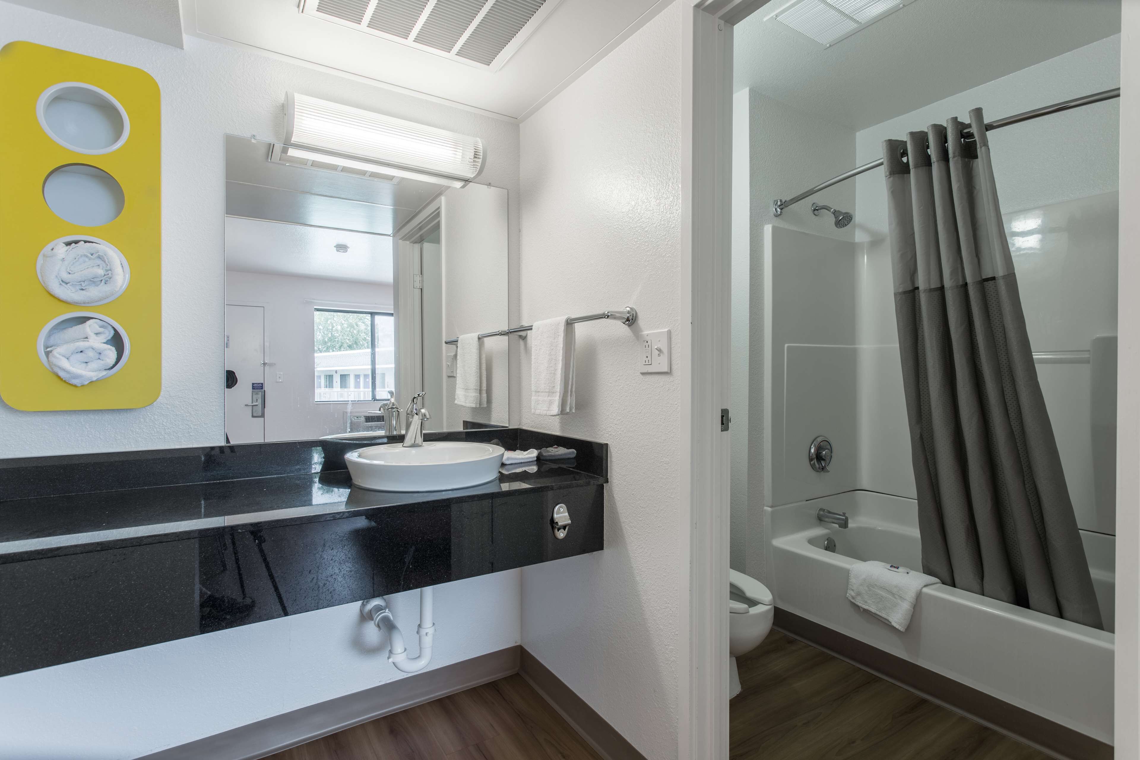 Combined shower/bathtub, towels, soap