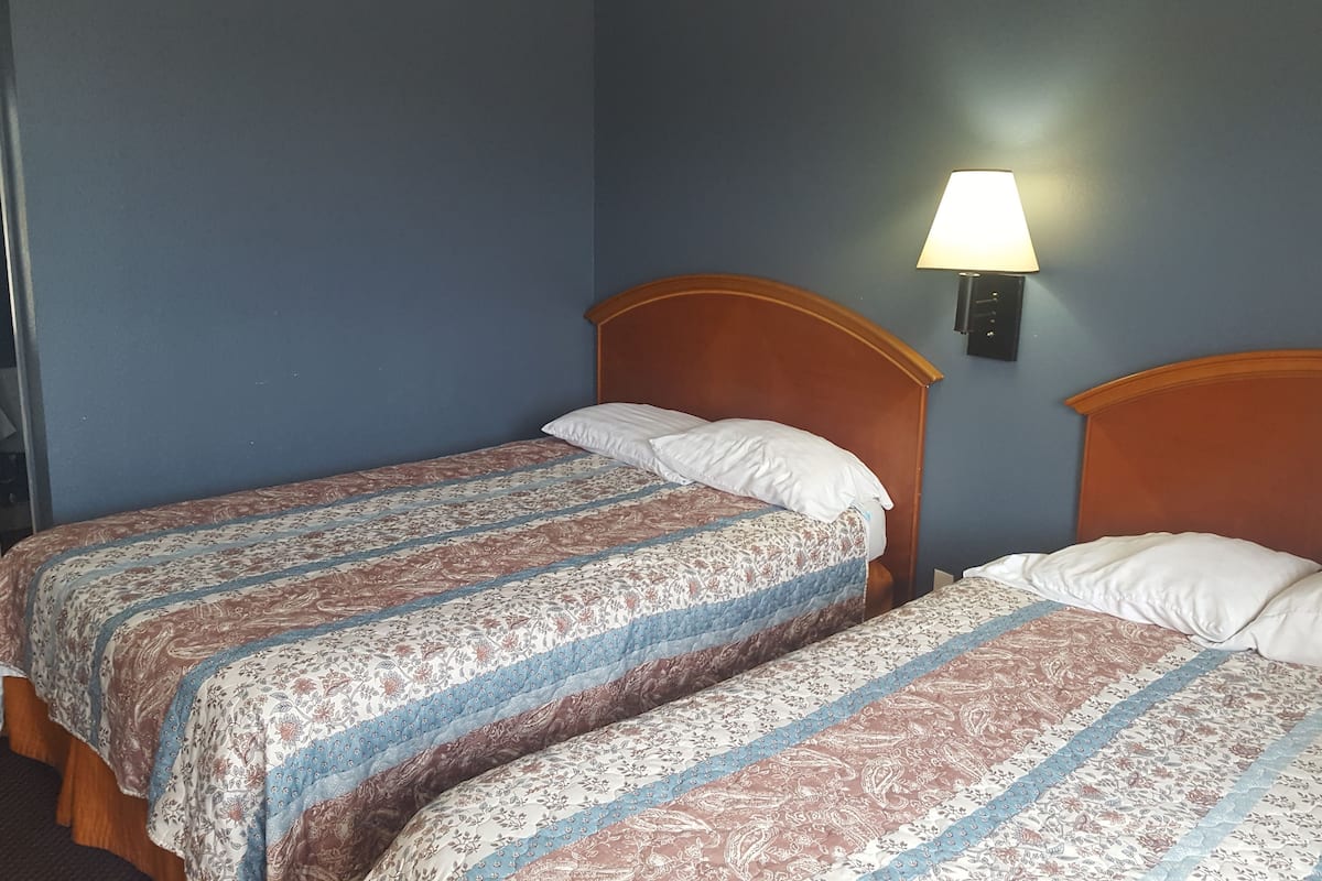 Desk, laptop workspace, free WiFi, bed sheets