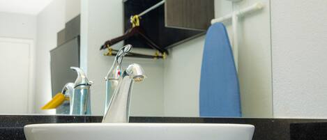 A bathroom sink with a mirror above it.