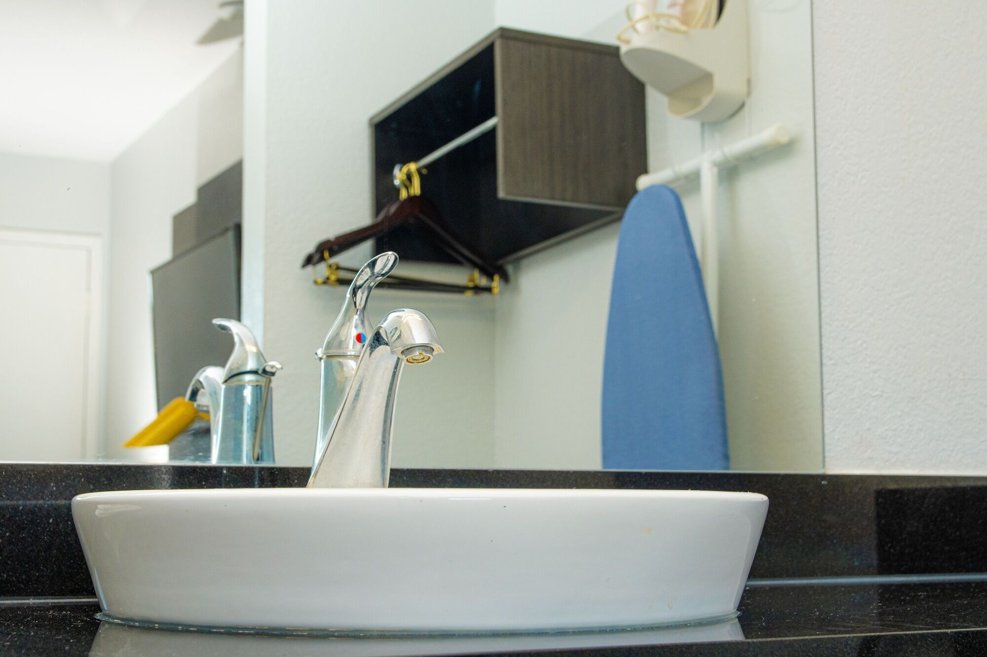 A bathroom sink with a mirror above it.