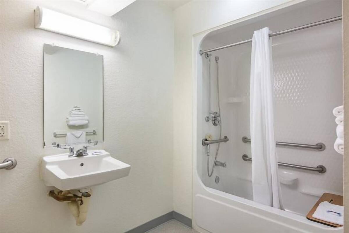 Combined shower/tub, hair dryer, towels, toilet paper