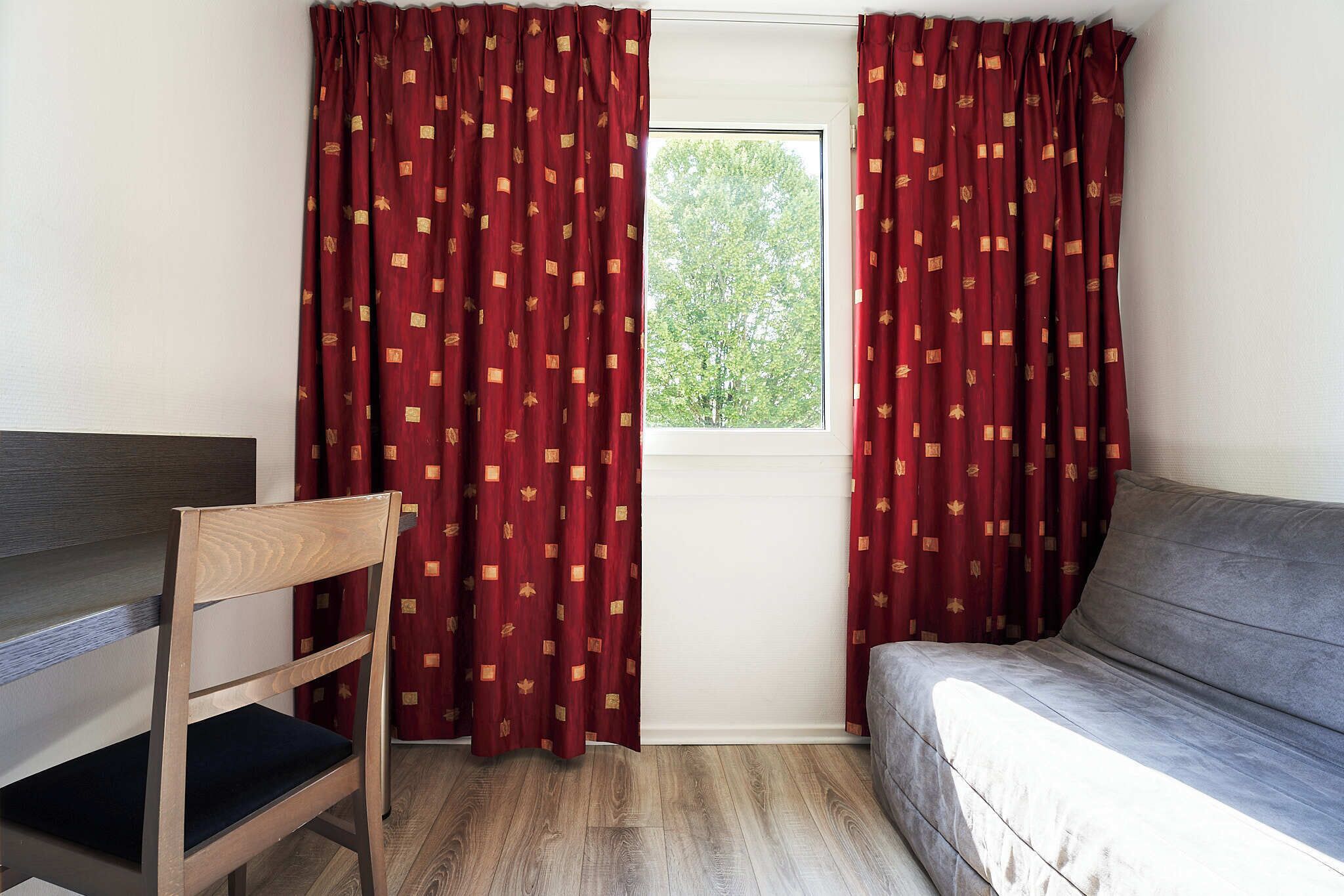 Comfort Room | Premium bedding, desk, blackout curtains, soundproofing