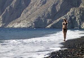 Beach nearby, black sand, beach towels