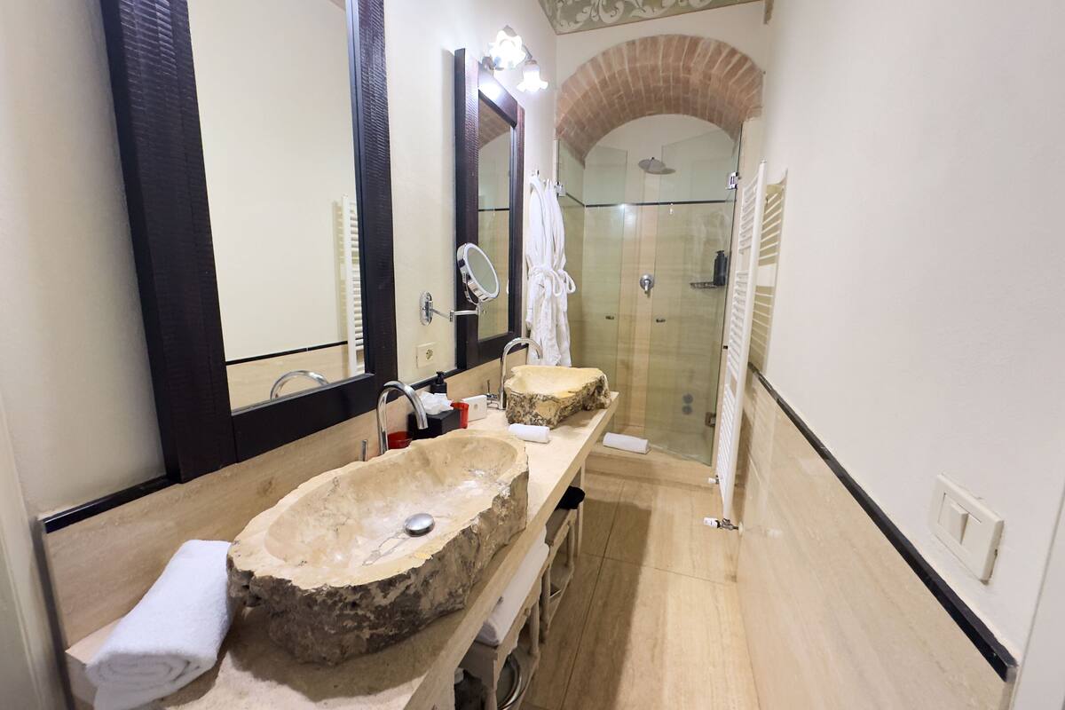 designer toiletries, hair dryer, bathrobes, slippers