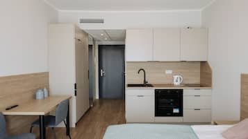 Fridge, stovetop, electric kettle, cookware/dishes/utensils