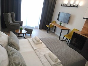 Ropa de cama hipoalergénica, minibar y espacio para trabajar con laptop 