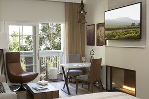 Luxury Room, 1 King Bed, River View | Living area | Flat-screen TV, iPod dock, pay movies