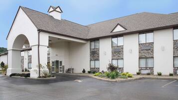 Stunning hotel entrance with arched doorway and large windows.