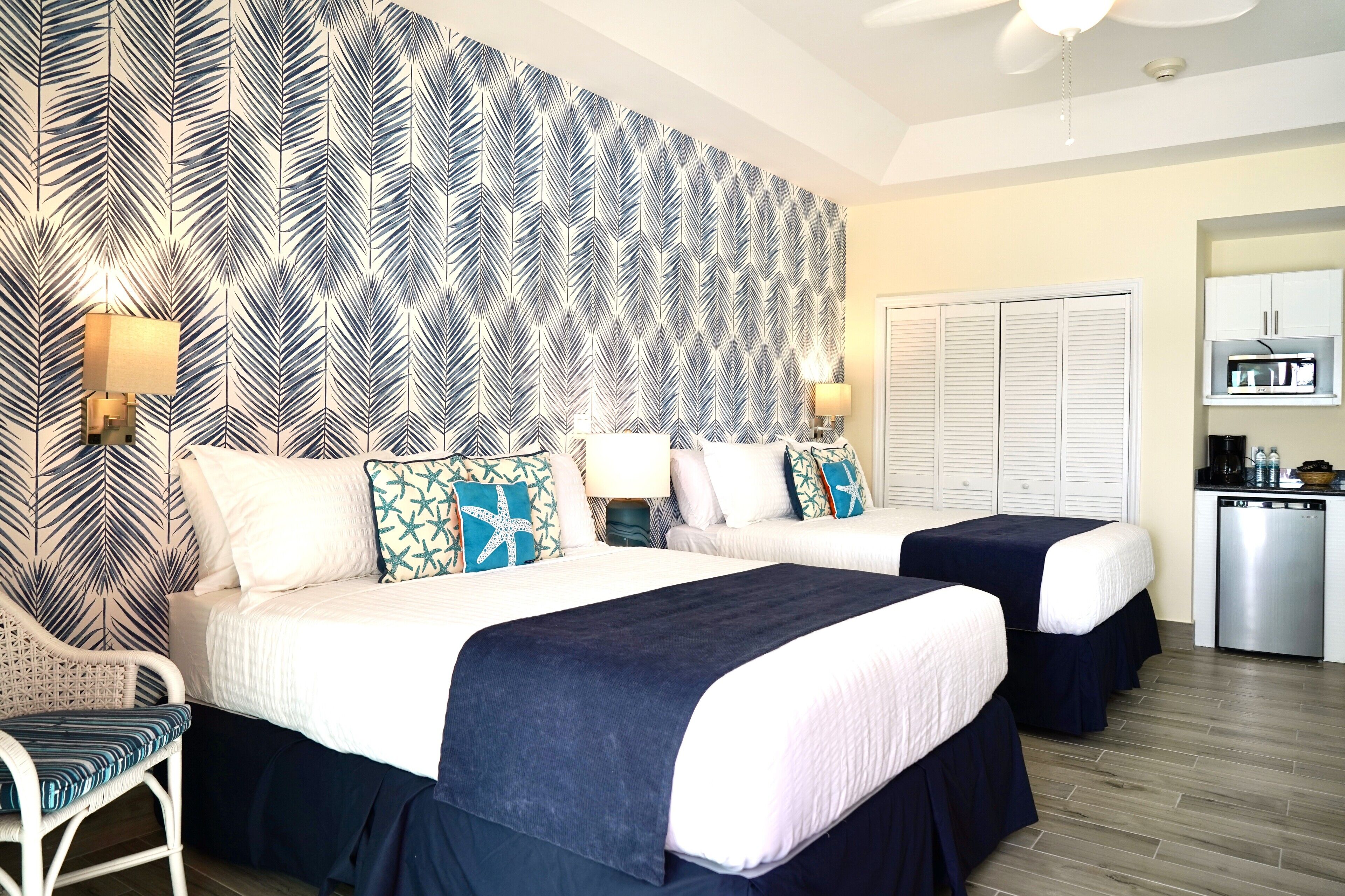 deluxe room, 2 queen beds, lagoon view | 1 bedroom, in-room safe, individually decorated, laptop workspace