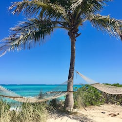 Private beach, white sand, sun loungers, beach umbrellas