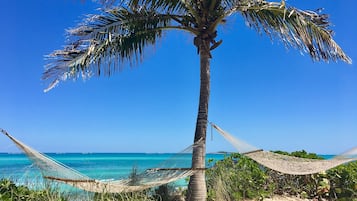 Private beach, white sand, sun loungers, beach umbrellas
