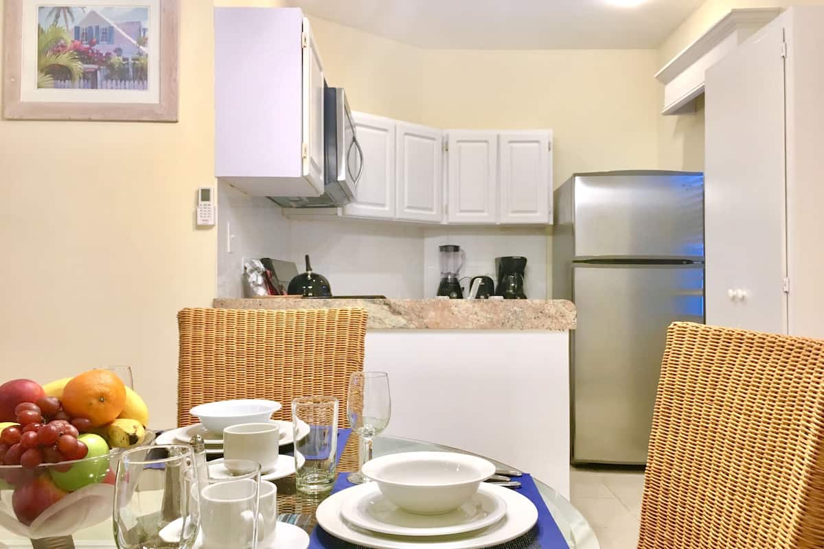 suite, 1 king bed with sofa bed, kitchen, lagoon view | private kitchen | fridge, microwave, coffee/tea maker, high chair