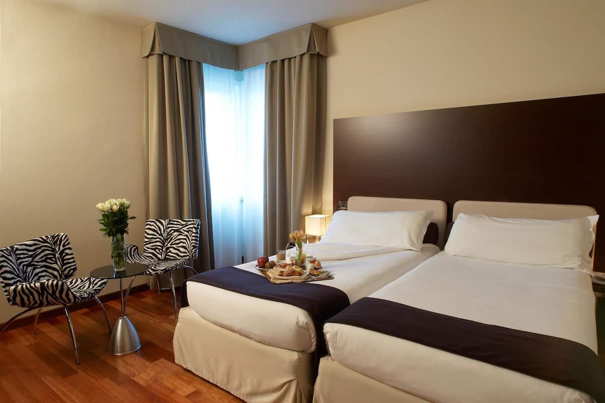 Egyptian cotton sheets, premium bedding, down duvets, minibar