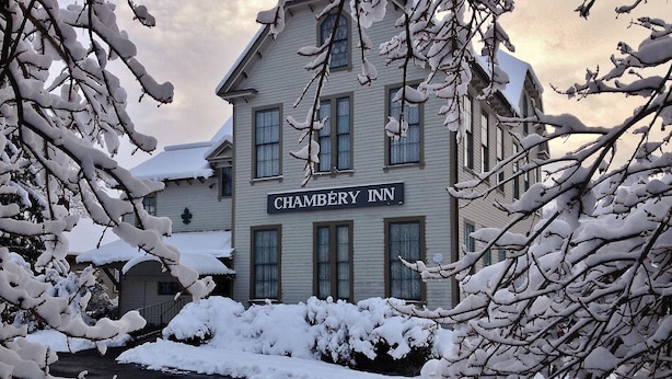 A two-story building with a sign reading "Chambéry Inn". - Chambery Inn (Lee)