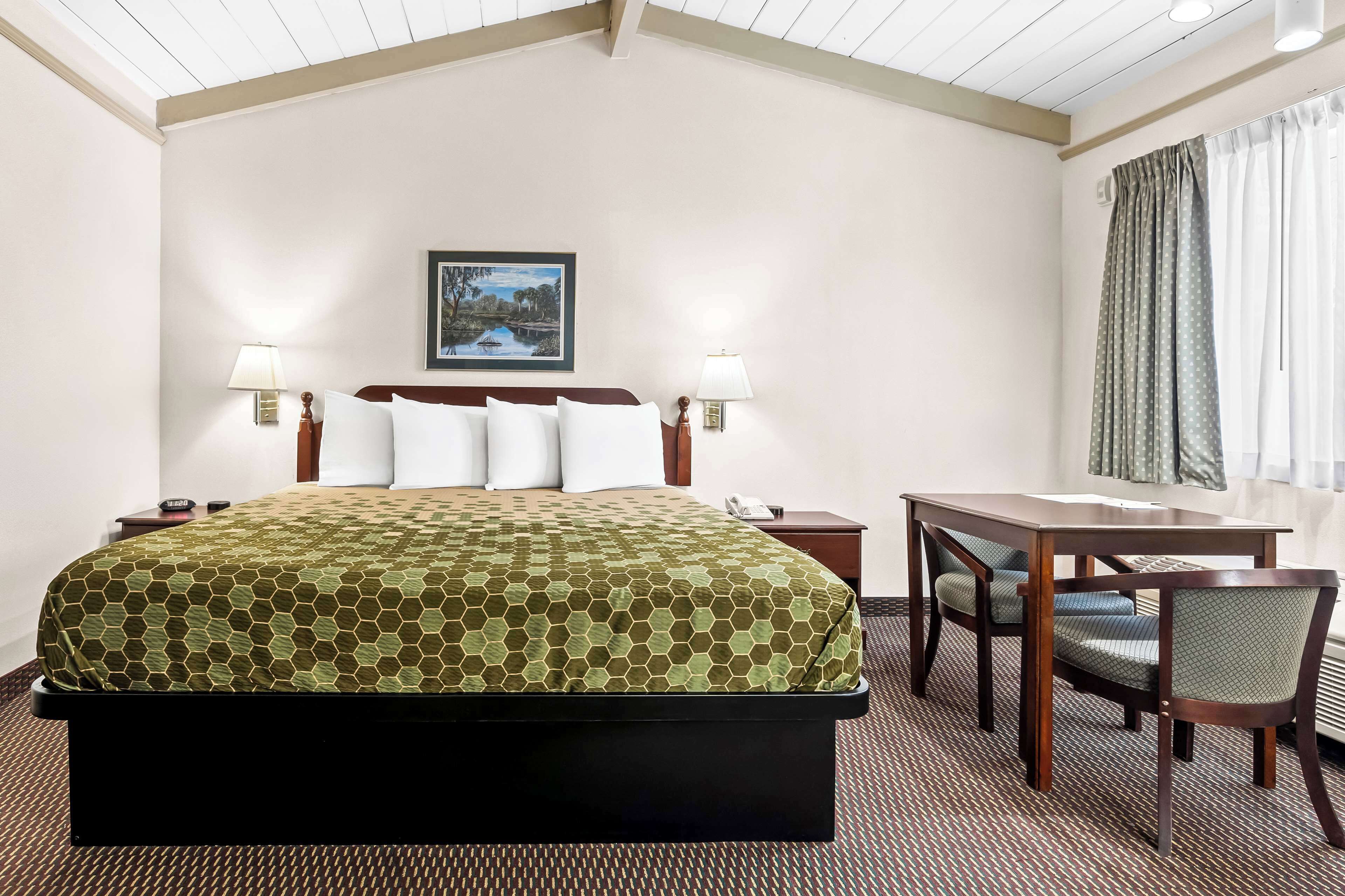 Desk, laptop workspace, blackout drapes, iron/ironing board