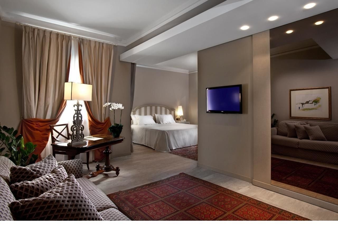 junior suite | living area | 42-inch flat-screen tv with satellite channels, tv, pay films