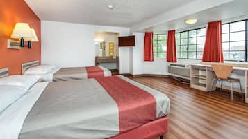 Desk, laptop workspace, bed sheets