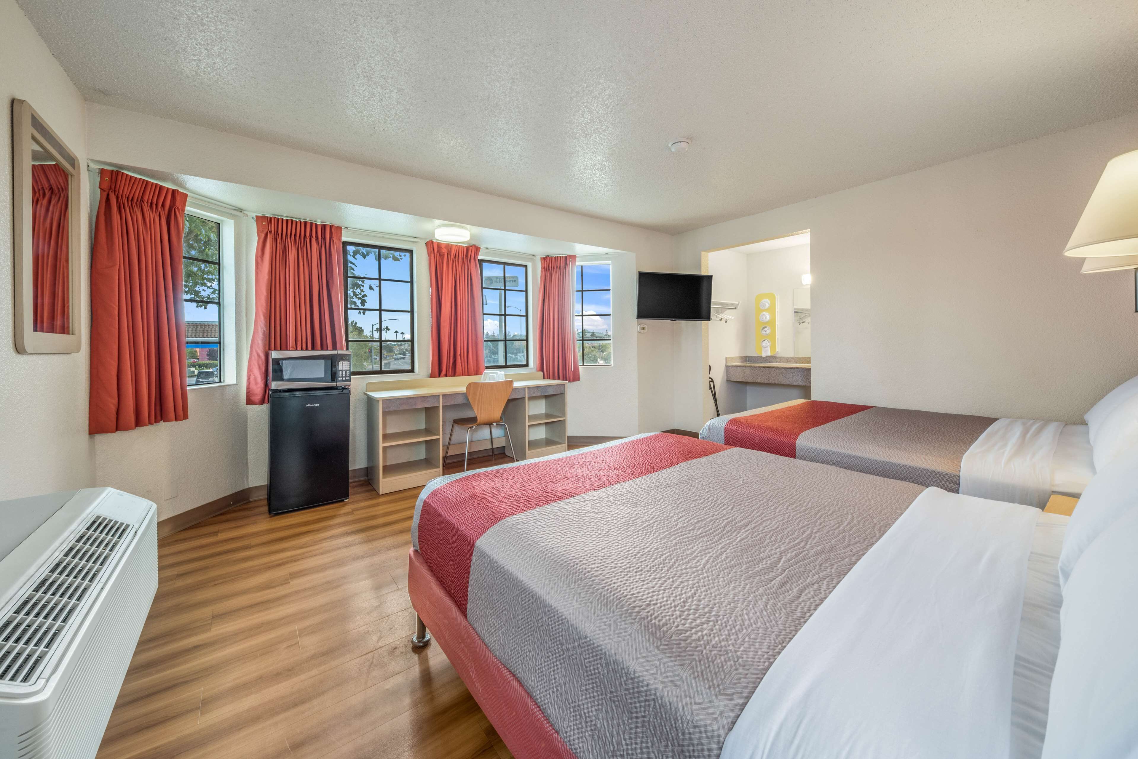 Desk, laptop workspace, bed sheets