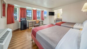 A hotel room with two beds, a desk, a chair, a TV, and a window with curtains. - Motel 6 Fairfield, CA - North (Fairfield)