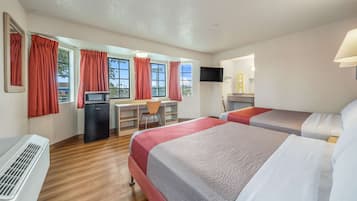 Desk, laptop workspace, bed sheets