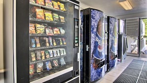A vending machine with snacks and a Pepsi refrigerator. - Motel 6 Middleburg Heights, OH - Cleveland (Middleburg Heights)