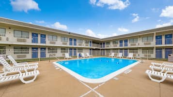 Relax by the hotel's central pool surrounded by comfortable lounge chairs.
