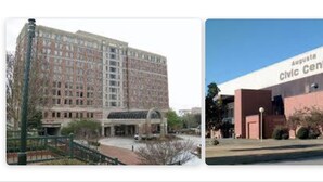 Two buildings: one is a multi-story brick building with a central entrance and a large glass facade; the other is a modern building with a flat roof and the name "August Civic Center" on its side. - Days Inn & Suites by Wyndham Augusta Near Fort Eisenhower (Grovetown)
