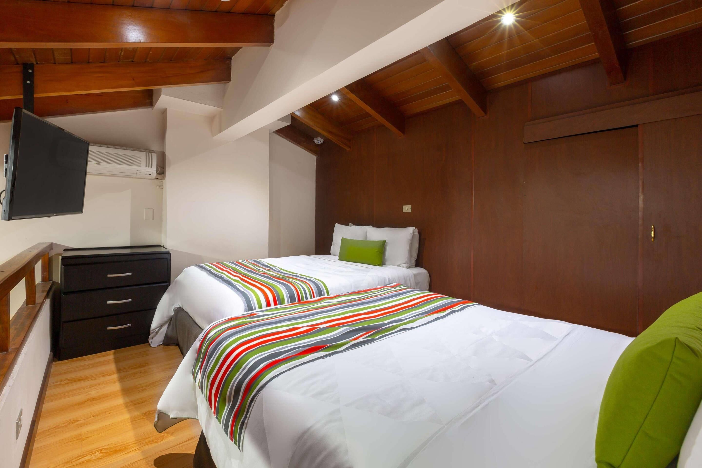 junior suite, 2 double beds | 1 bedroom, premium bedding, in-room safe, desk