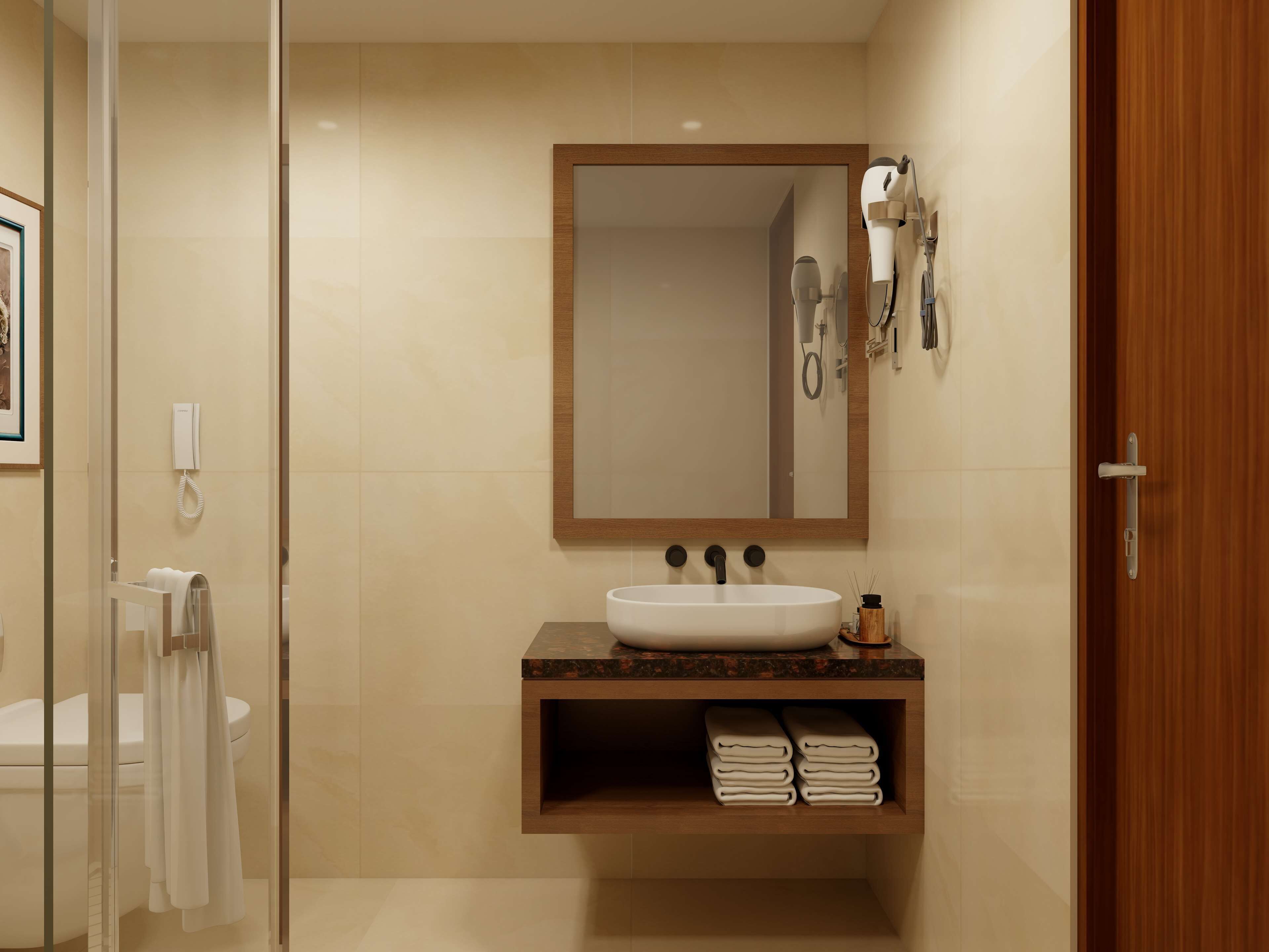 Un baño con un espejo grande, un lavabo, un perchero para toallas y una zona de ducha.