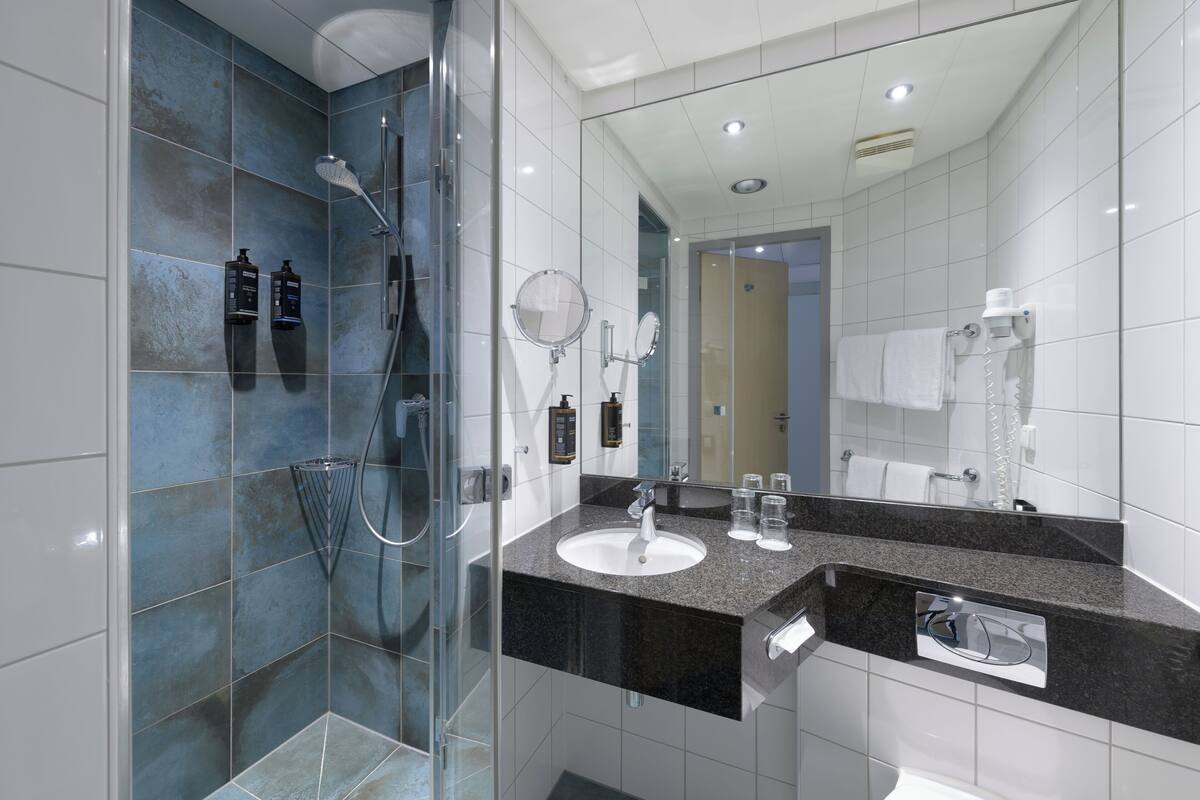 room, multiple beds | bathroom | shower, eco-friendly toiletries, hair dryer, towels