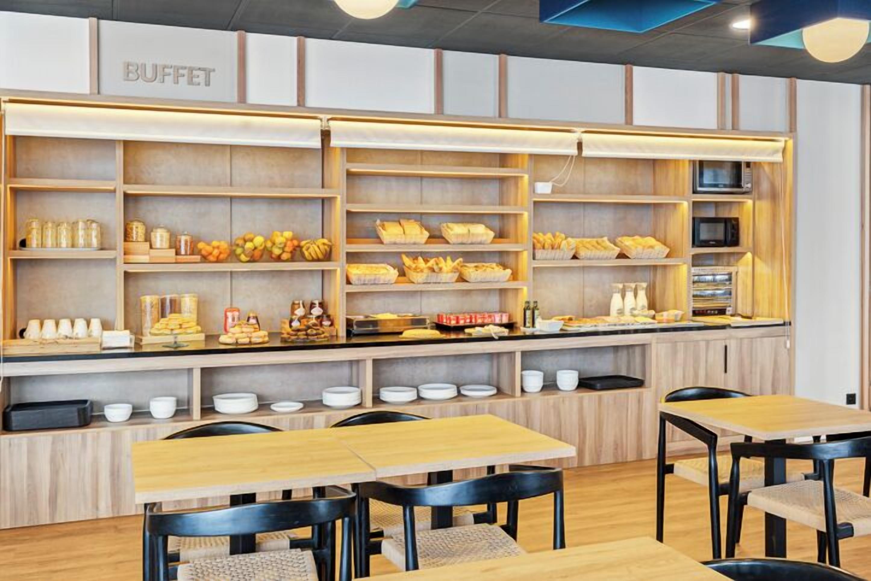 A buffet area with wooden shelves and tables.