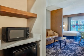 Premium bedding, desk, laptop workspace, blackout drapes